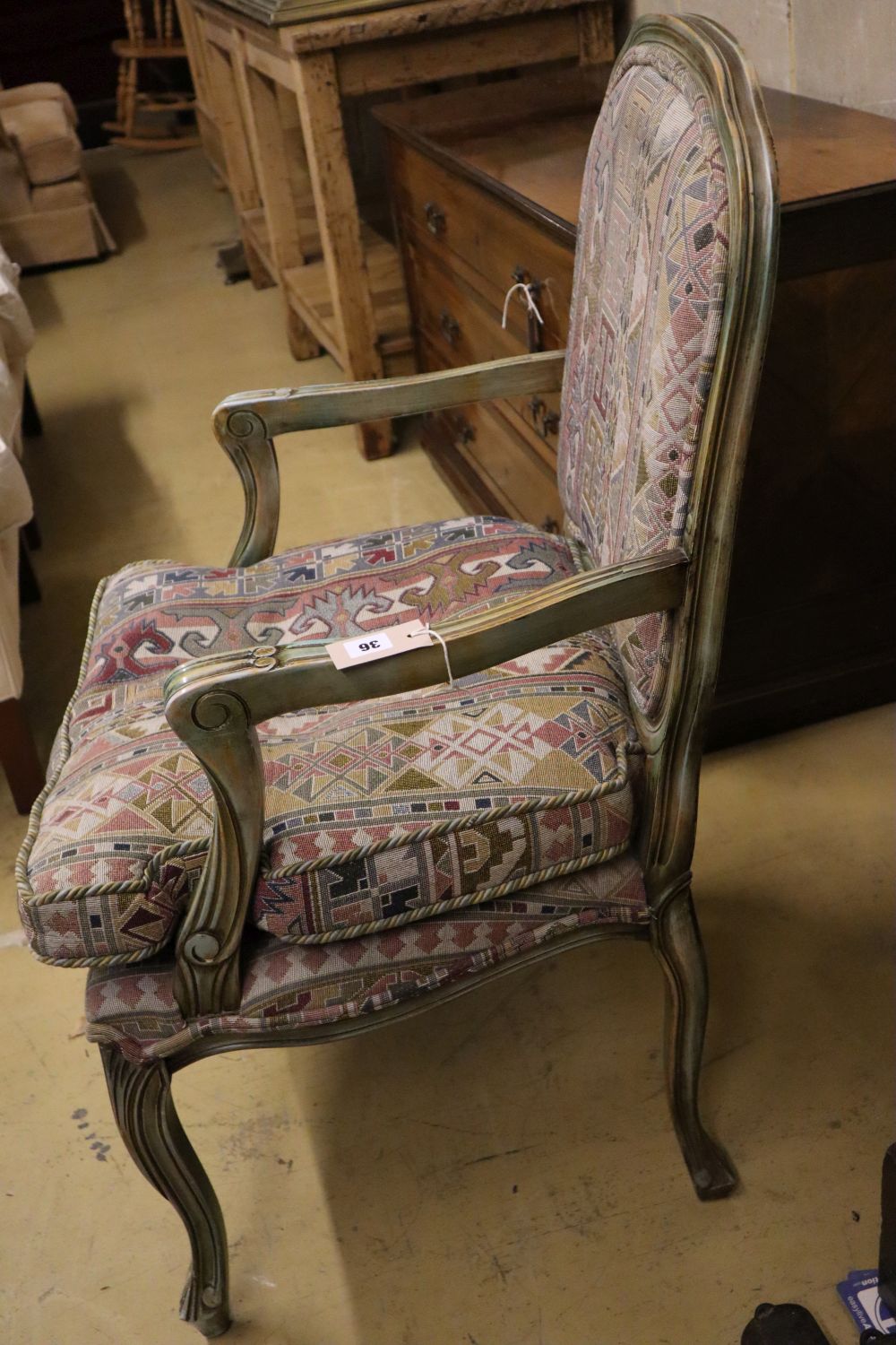 A French painted upholstered open armchair